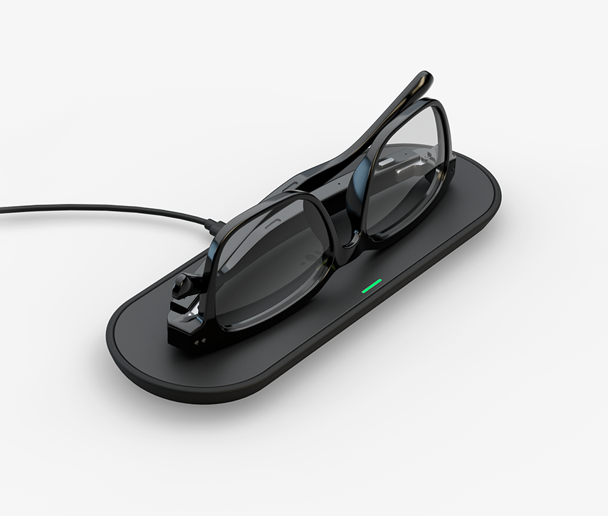 The Nuance Audio glasses getting charged on the charging pad