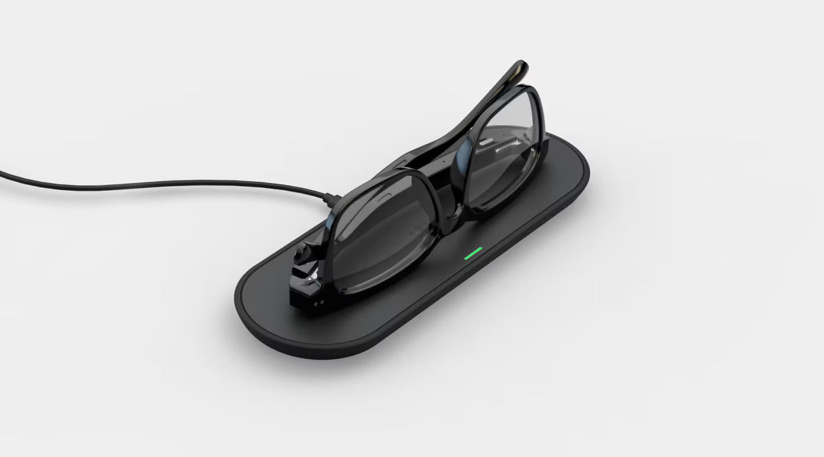 Black glasses case with a pair of glasses on a white background